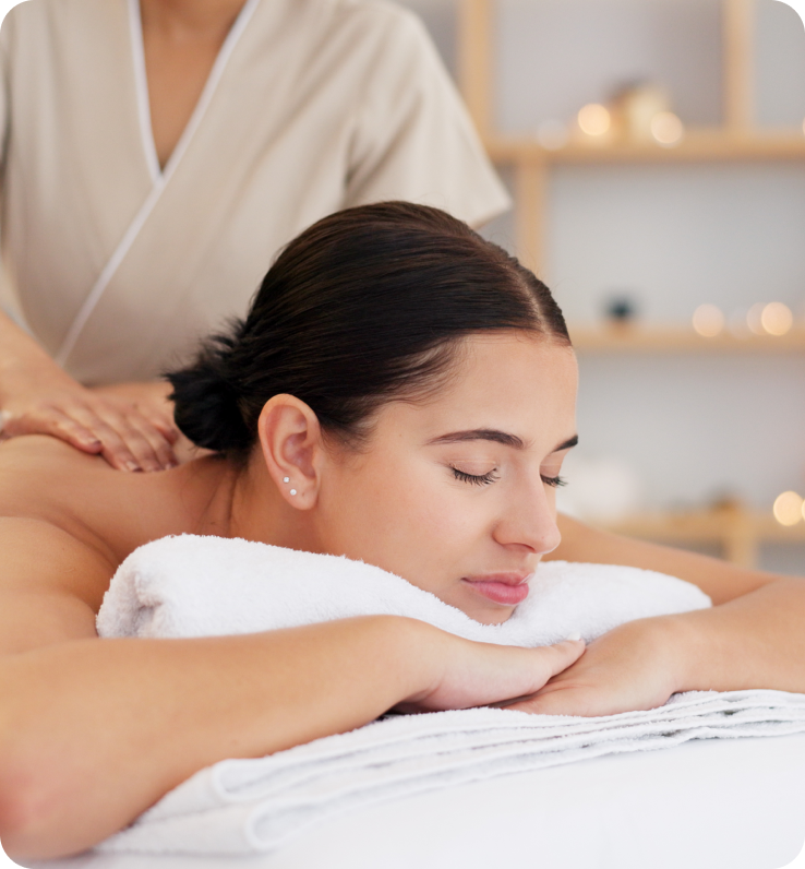 Woman receiving relaxing back massage at spa.