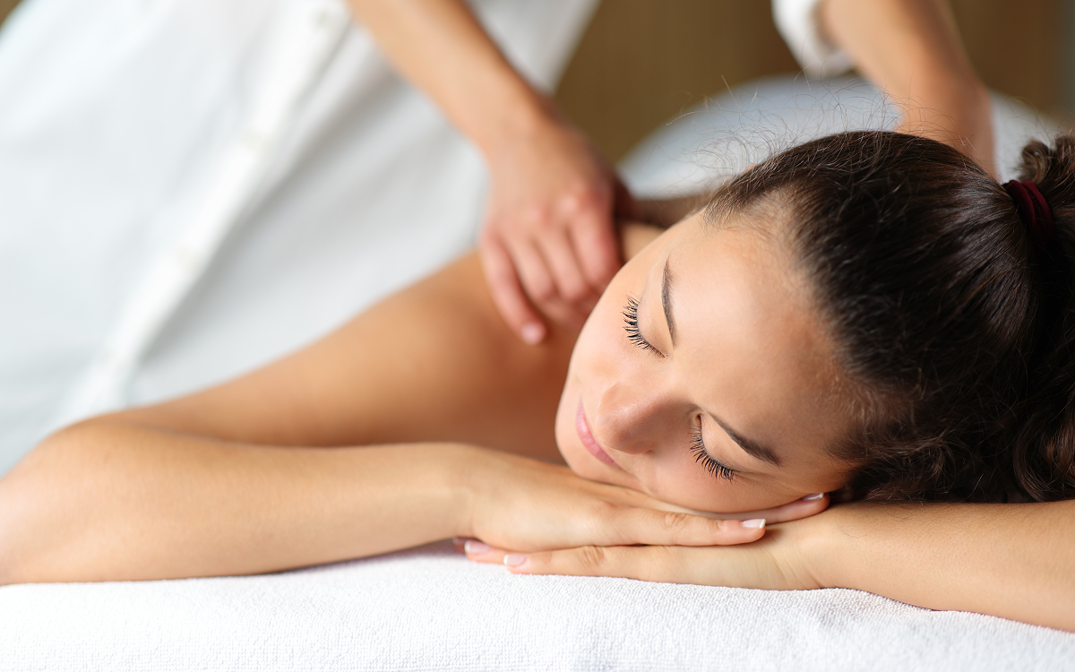 Woman receiving a relaxing back massage.