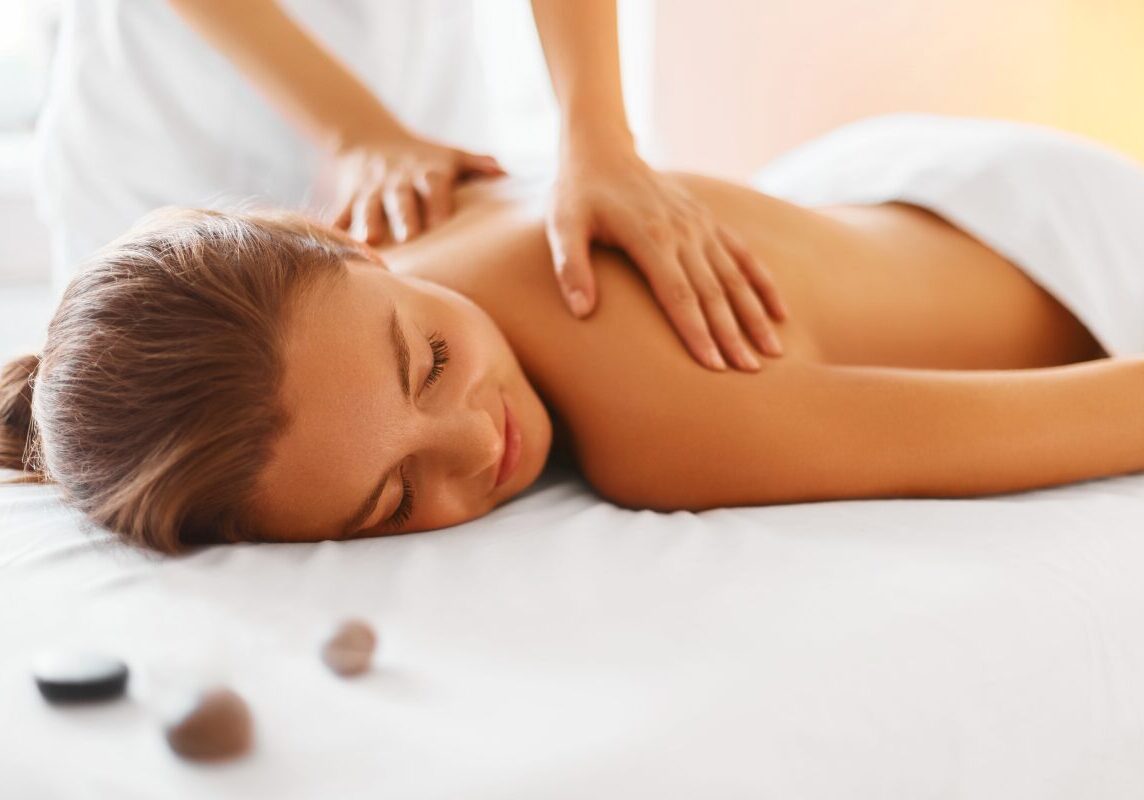 Woman receiving a relaxing back massage.